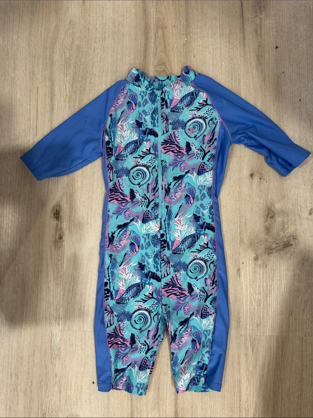 Coolibar toddler girl neck to knee Blue Seashell Print Zip-Front swimwuit